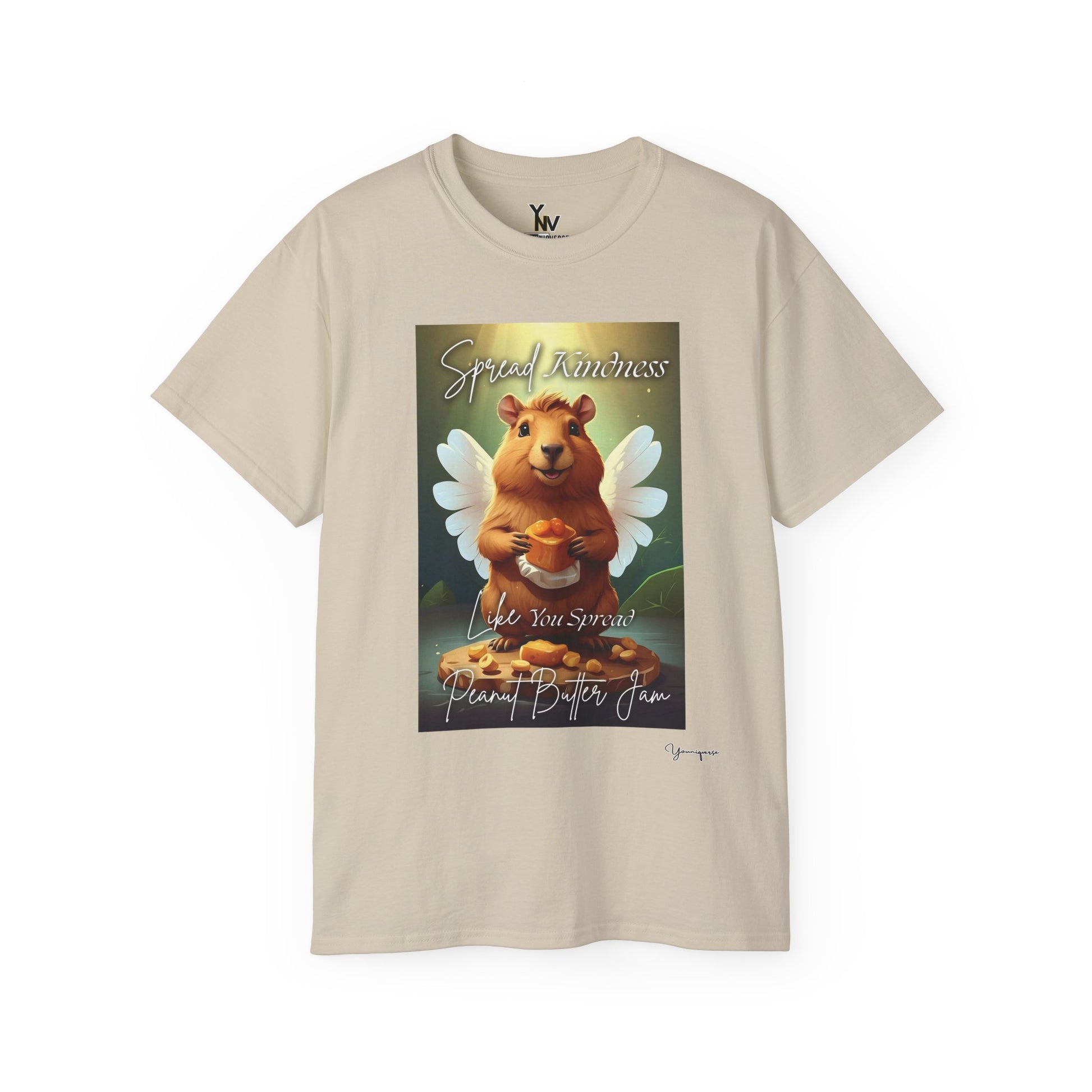 Sand unisex t-shirt with a cheerful smiling capybara with angel wings holding a block of peanut butter, Spread Kindness Like You Spread Peanut Butter Jam by Youniqverse