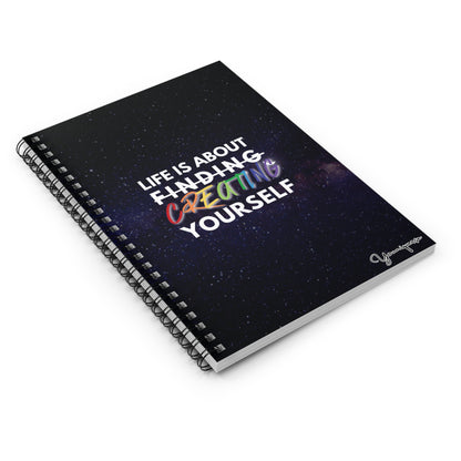 Spiral Notebook with universe background with inspiring quote Life is About Finding Creating Yourself on table by Youniqverse