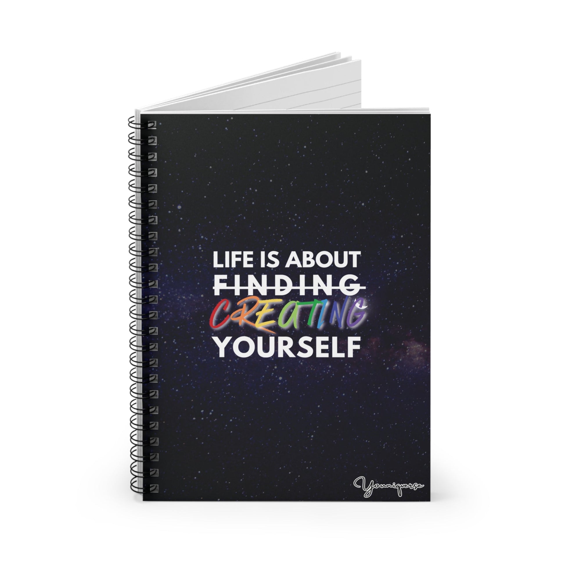 Opening Spiral Notebook with universe background with inspiring quote Life is About Finding Creating Yourself by Youniqverse